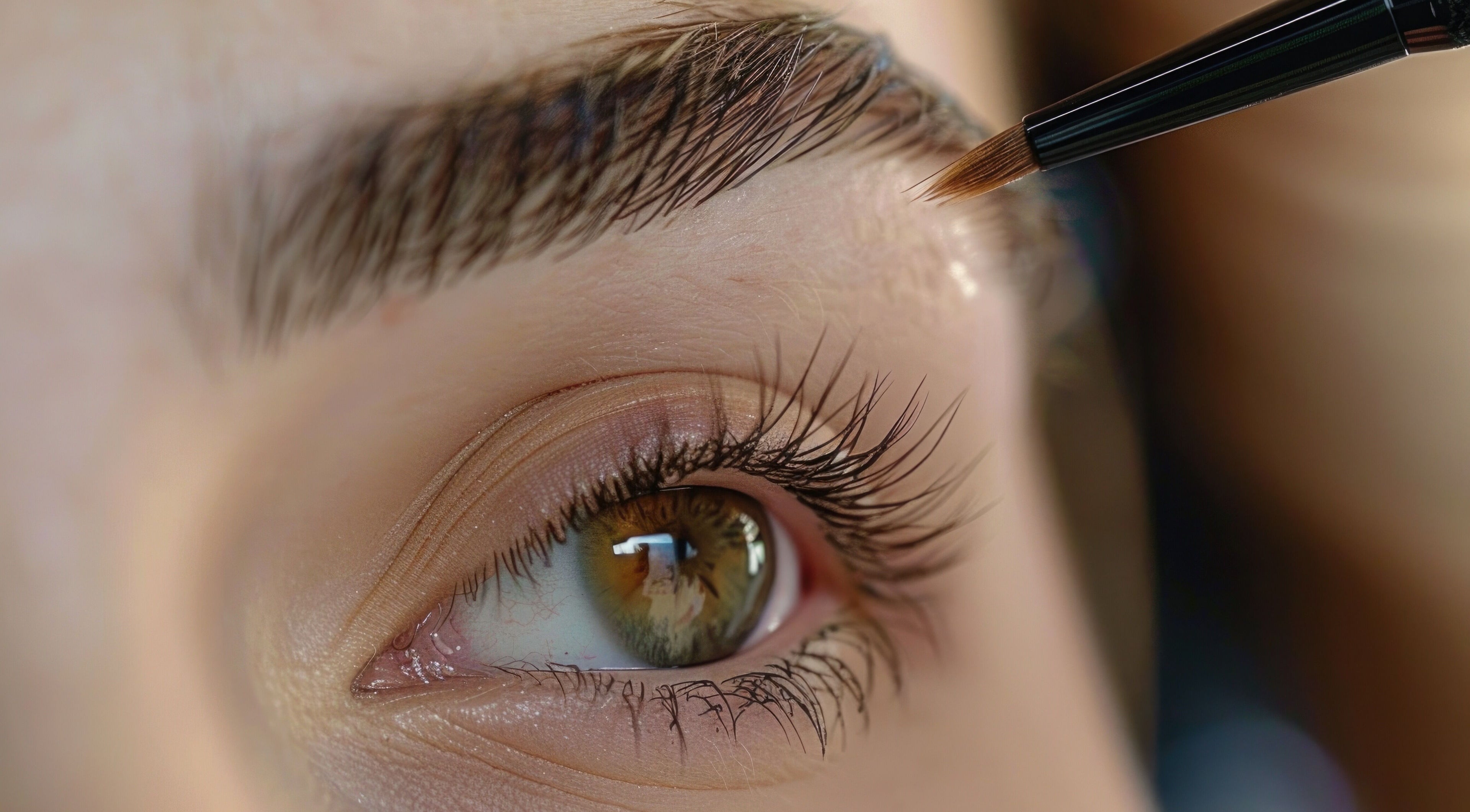 Close-up of eyebrow grooming with brush at Fabulashes and Head Spa, Cincinnati, Ohio, US.