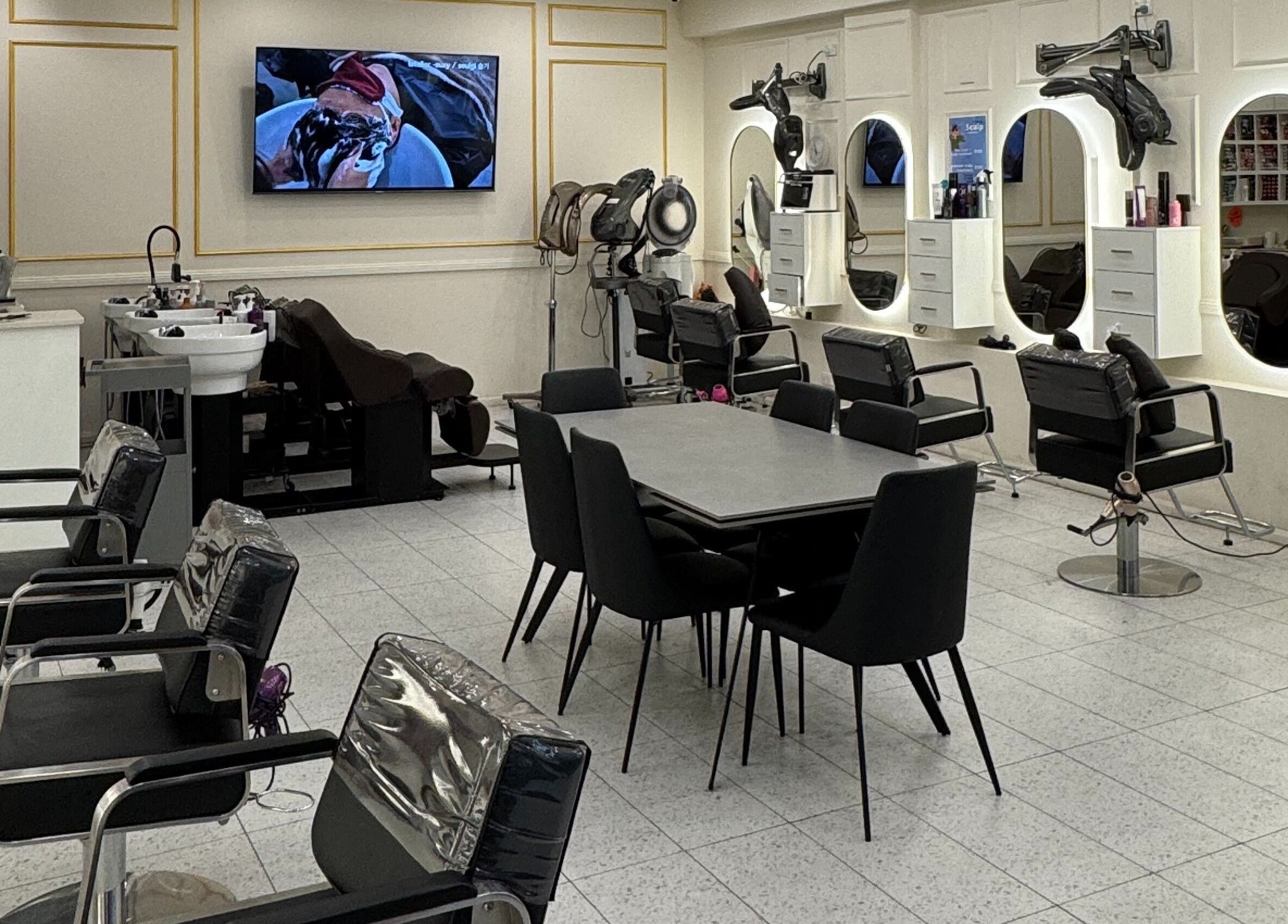 Modern salon chairs and mirrors at L’atelier no.1 in Sydney, New South Wales, AU, offering a stylish experience.