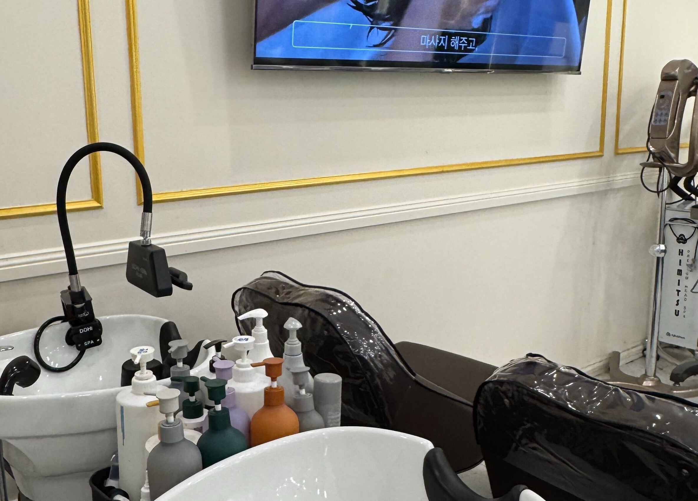 Shampoo stations at L’atelier no.1, Sydney, New South Wales, AU featuring luxurious hair care products.