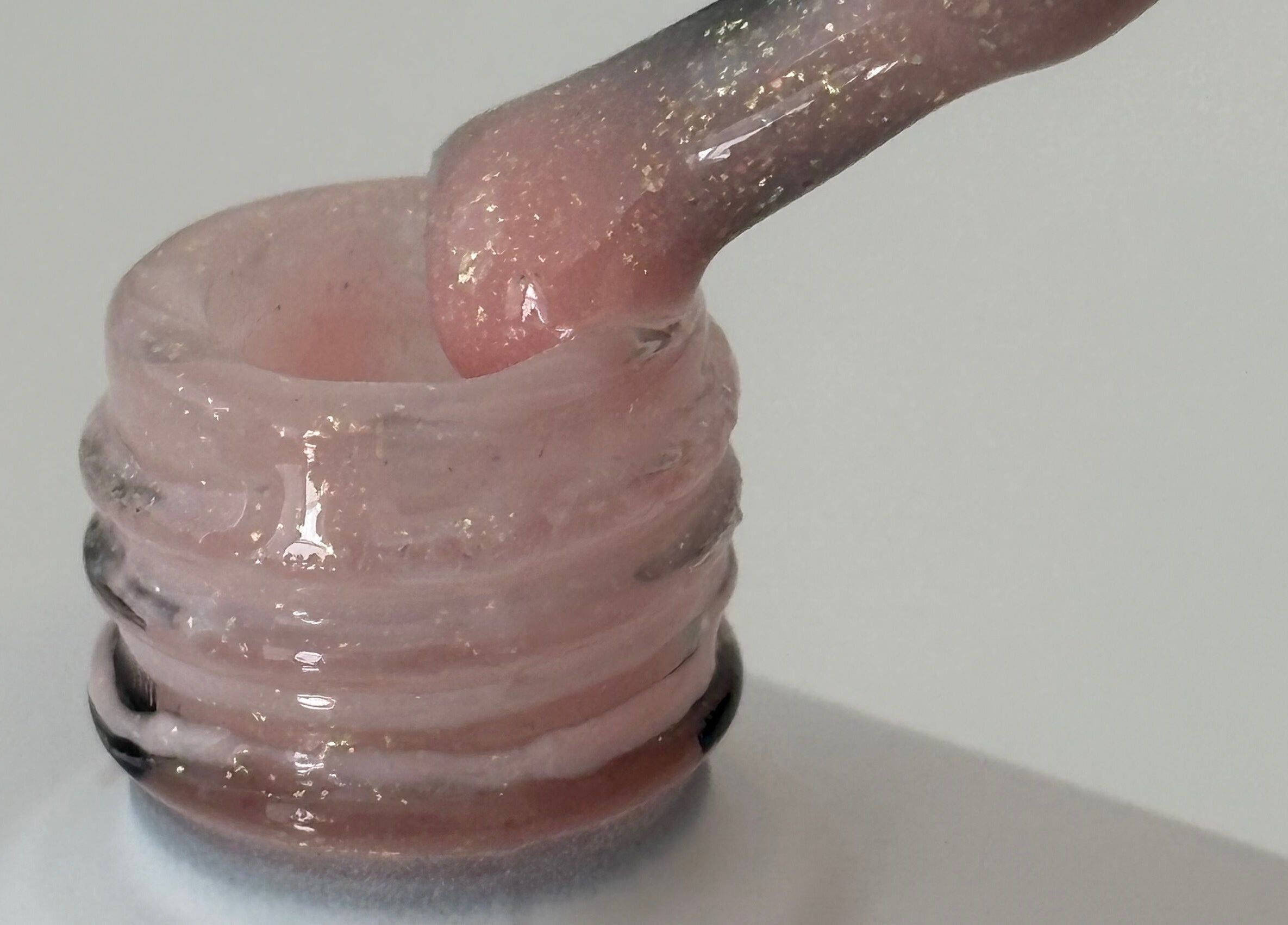 Close-up of shimmering pink nail polish from Nails by Kirsty in Balbriggan, County Dublin, IE.