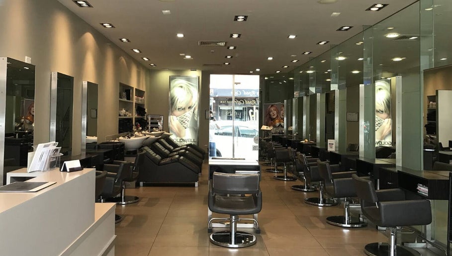 Modern interior of She hairdressing in Melbourne, Victoria, AU with sleek salon chairs and mirrors.