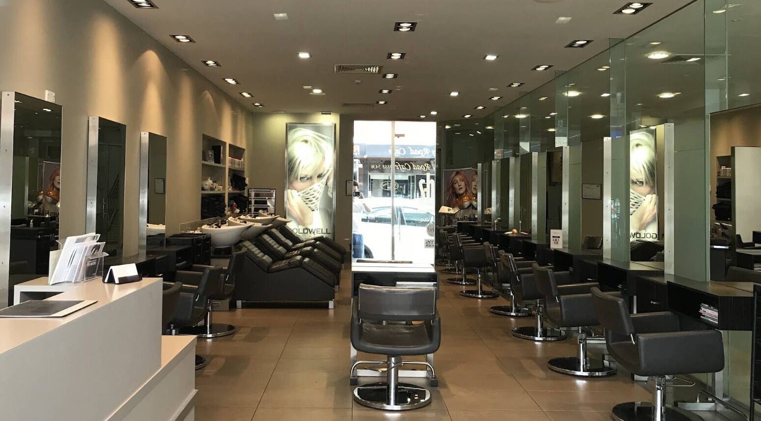 Modern interior of She hairdressing in Melbourne, Victoria, AU with sleek salon chairs and mirrors.