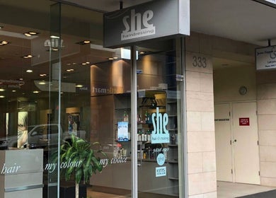 She hairdressing entrance showcasing modern decor and services in Melbourne, Victoria, AU.