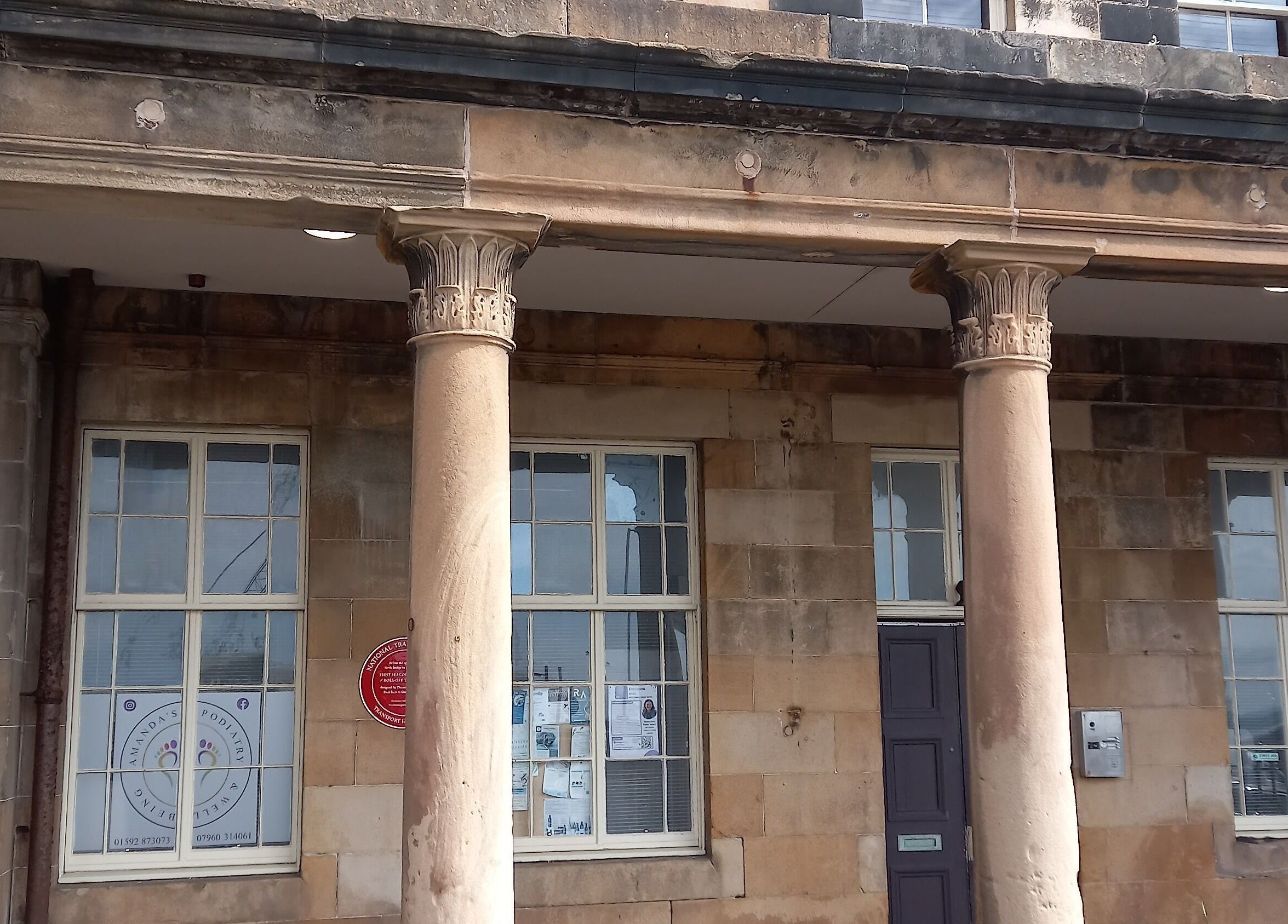 Front view of Healthysole Reflexology in Burntisland, Scotland, GB, showcasing classic stone columns.