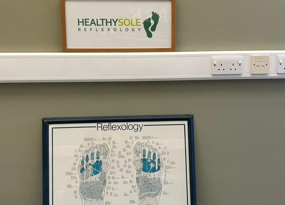 Interior of Healthysole Reflexology, Burntisland, Scotland, GB, showcasing reflexology chart and venue signage.