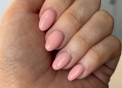 Elegant pink manicure at Byellaofm, Birmingham, England, GB, showcasing glossy, perfectly shaped nails.