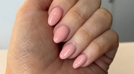 Elegant pink manicure at Byellaofm, Birmingham, England, GB, showcasing glossy, perfectly shaped nails.