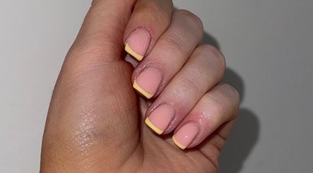 Yellow-tipped French manicure at Byellaofm, Birmingham, England, GB showcasing elegant nail design.