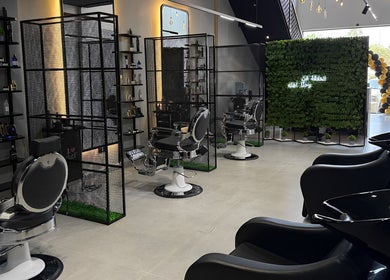 Interior of Ace Lebanese Barber Shop in Al Khobar, Eastern Province, SA featuring sleek barber chairs and decor.