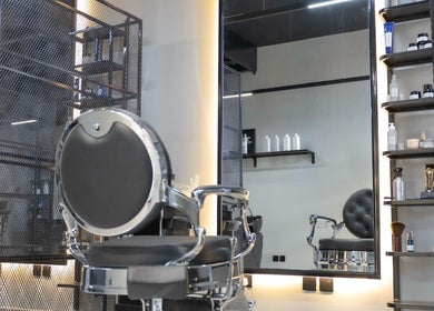 Modern interior of Ace Lebanese Barber Shop in Al Khobar, Eastern Province, SA with luxurious barber chair.