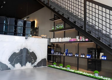 Front desk area of Ace Lebanese Barber Shop in Al Khobar, Eastern Province, SA with sleek decor.