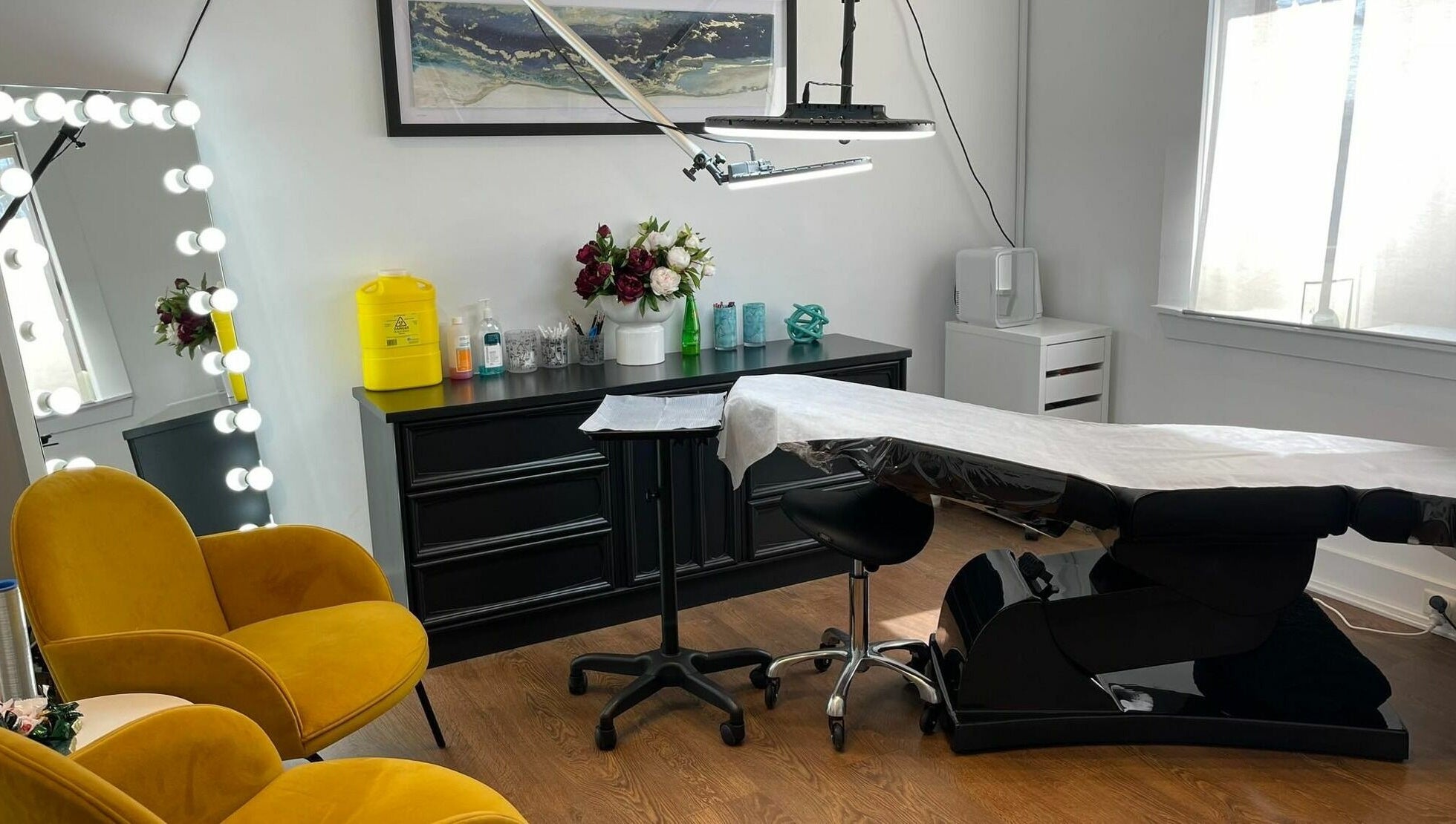 Stylish interior of Flutter Beauty Studio in Melbourne, Victoria, AU with modern chairs and equipped treatment area.