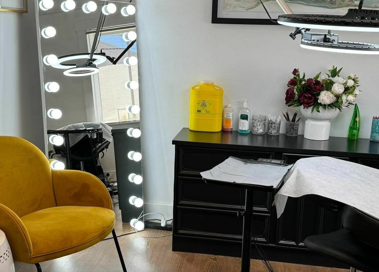 Elegant interior of Flutter Beauty Studio, Melbourne, Victoria, AU with stylish seating and modern decor.