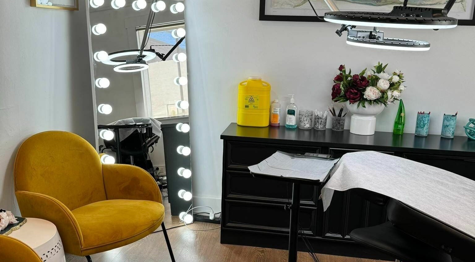 Elegant interior of Flutter Beauty Studio, Melbourne, Victoria, AU with stylish seating and modern decor.