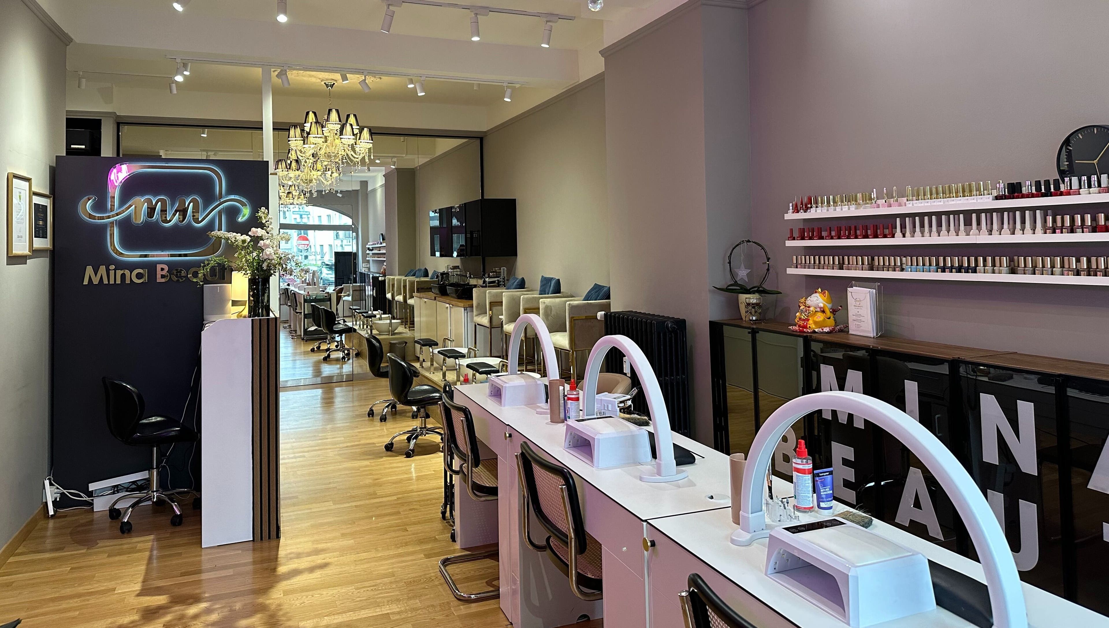 Interior of Mina Beauty Seefeld in Zürich, showcasing elegant design and nail care stations.