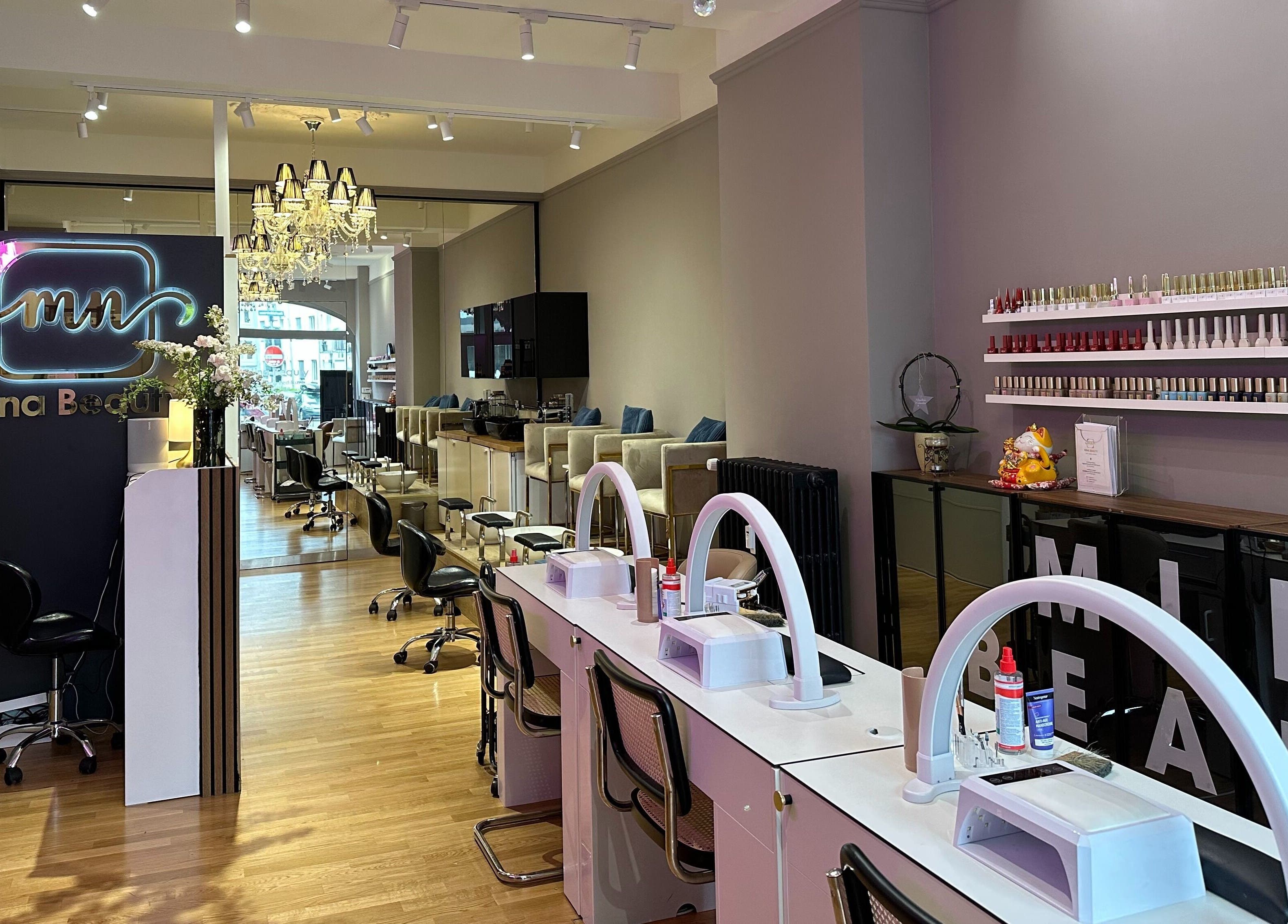 Interior of Mina Beauty Seefeld in Zürich, showcasing elegant design and nail care stations.