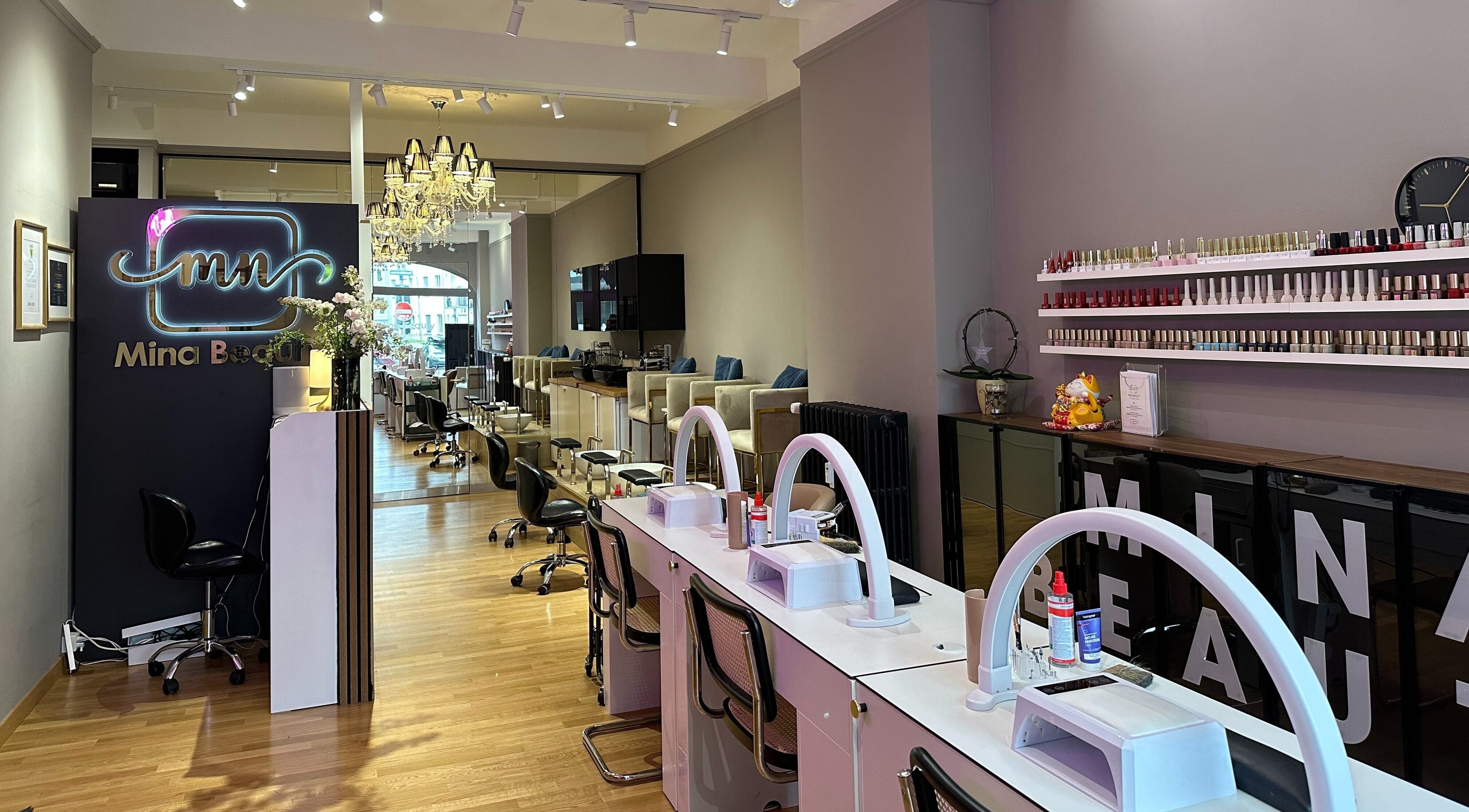 Interior of Mina Beauty Seefeld in Zürich, showcasing elegant design and nail care stations.