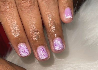 Elegant lavender swirl nail art at TipTastic Nails, Plymouth, Tobago, TT showcasing delicate designs.