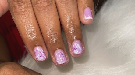 Elegant lavender swirl nail art at TipTastic Nails, Plymouth, Tobago, TT showcasing delicate designs.