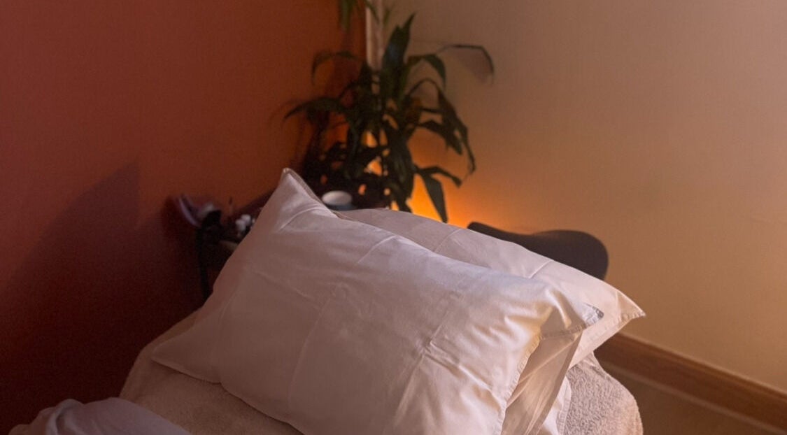 Cozy massage bed at Rooted in Rest, Auchterarder, Scotland, GB, inviting relaxation.