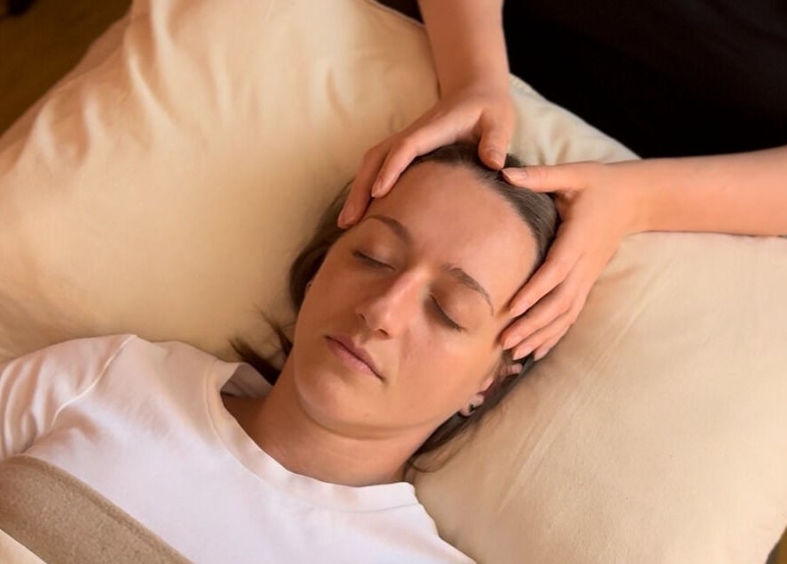 Relaxing head massage at Rooted in Rest, Auchterarder, Scotland, GB, easing tension for holistic wellness.