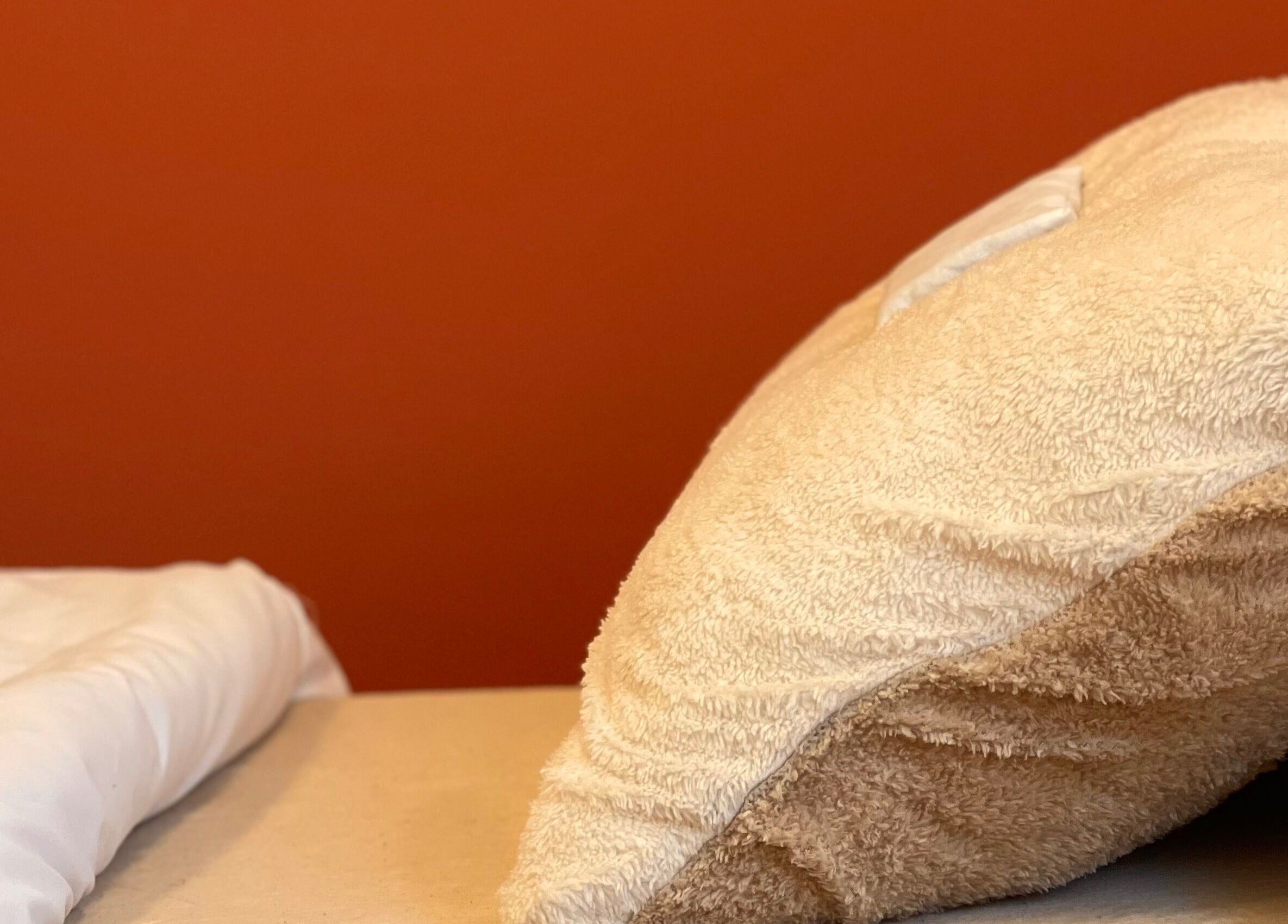 Cozy pillow and blanket at Rooted in Rest, Auchterarder, Scotland, GB, showcasing peaceful relaxation space.