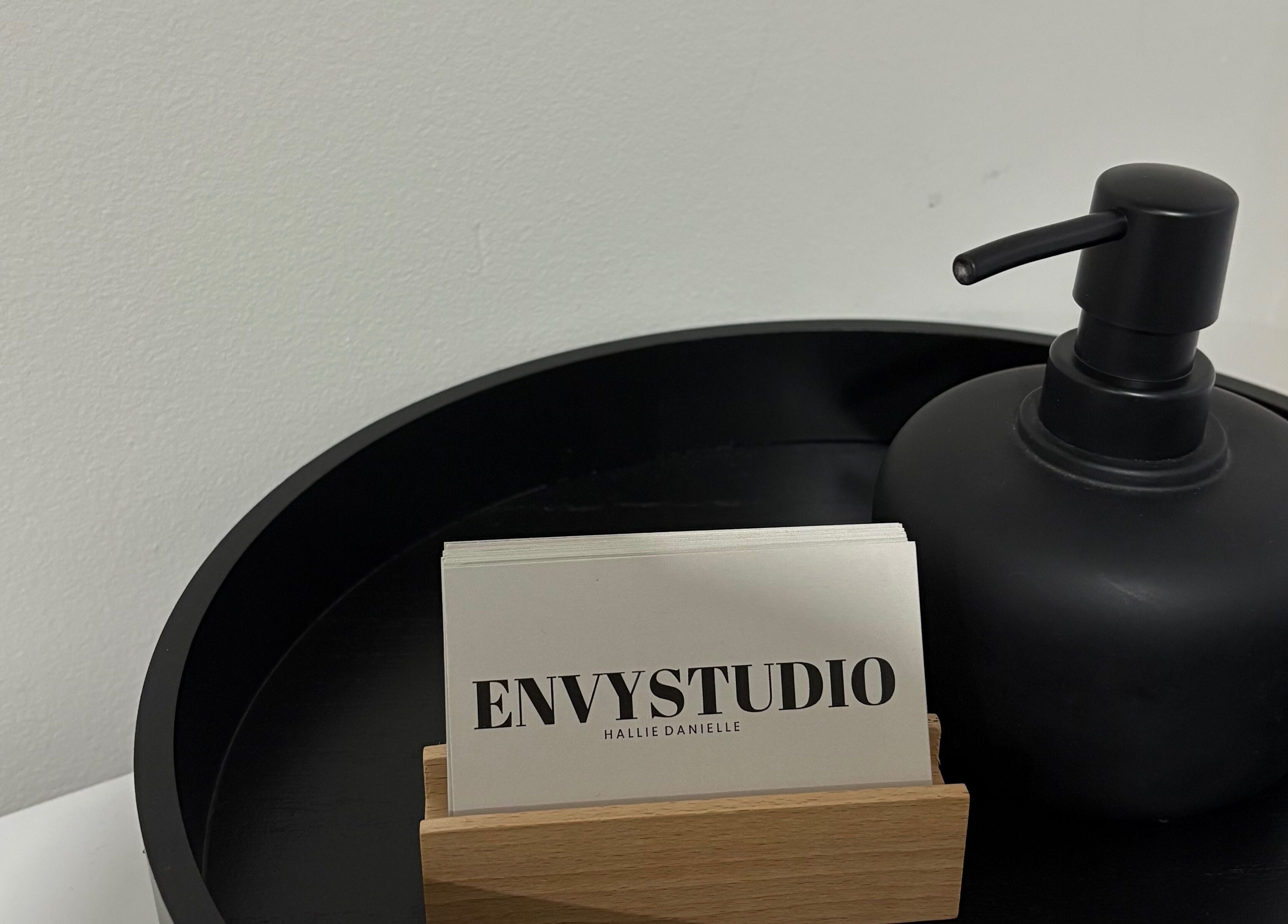 Business cards and soap dispenser at EnvyStudio, Banstead, England, GB. A touch of elegance.