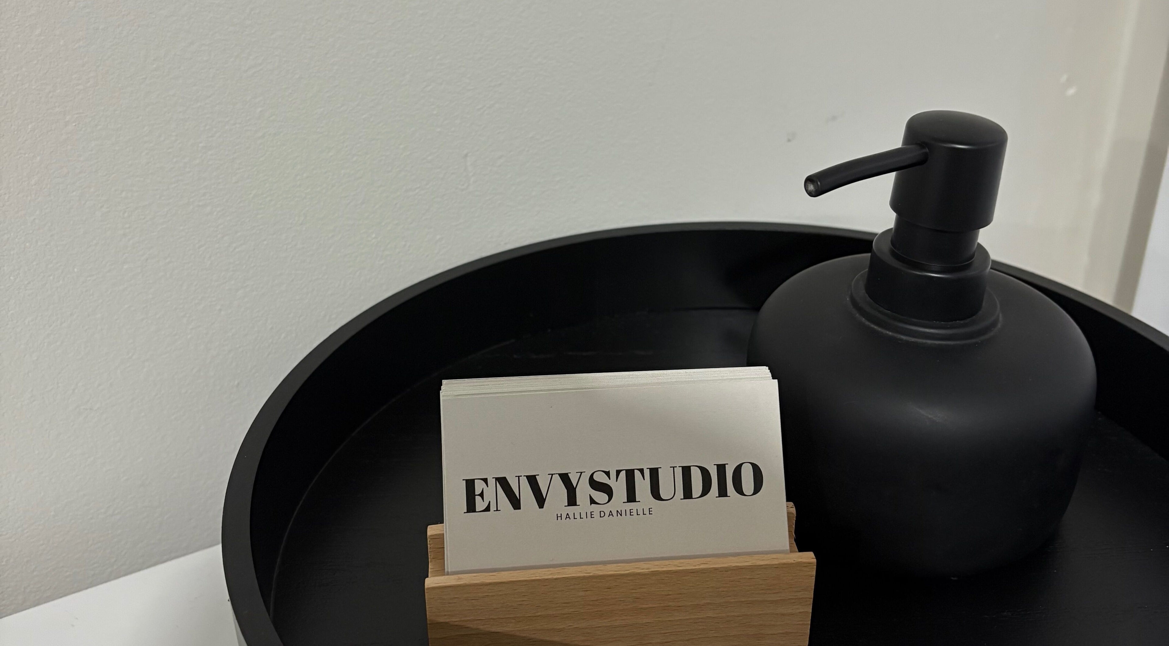 Business cards and soap dispenser at EnvyStudio, Banstead, England, GB. A touch of elegance.