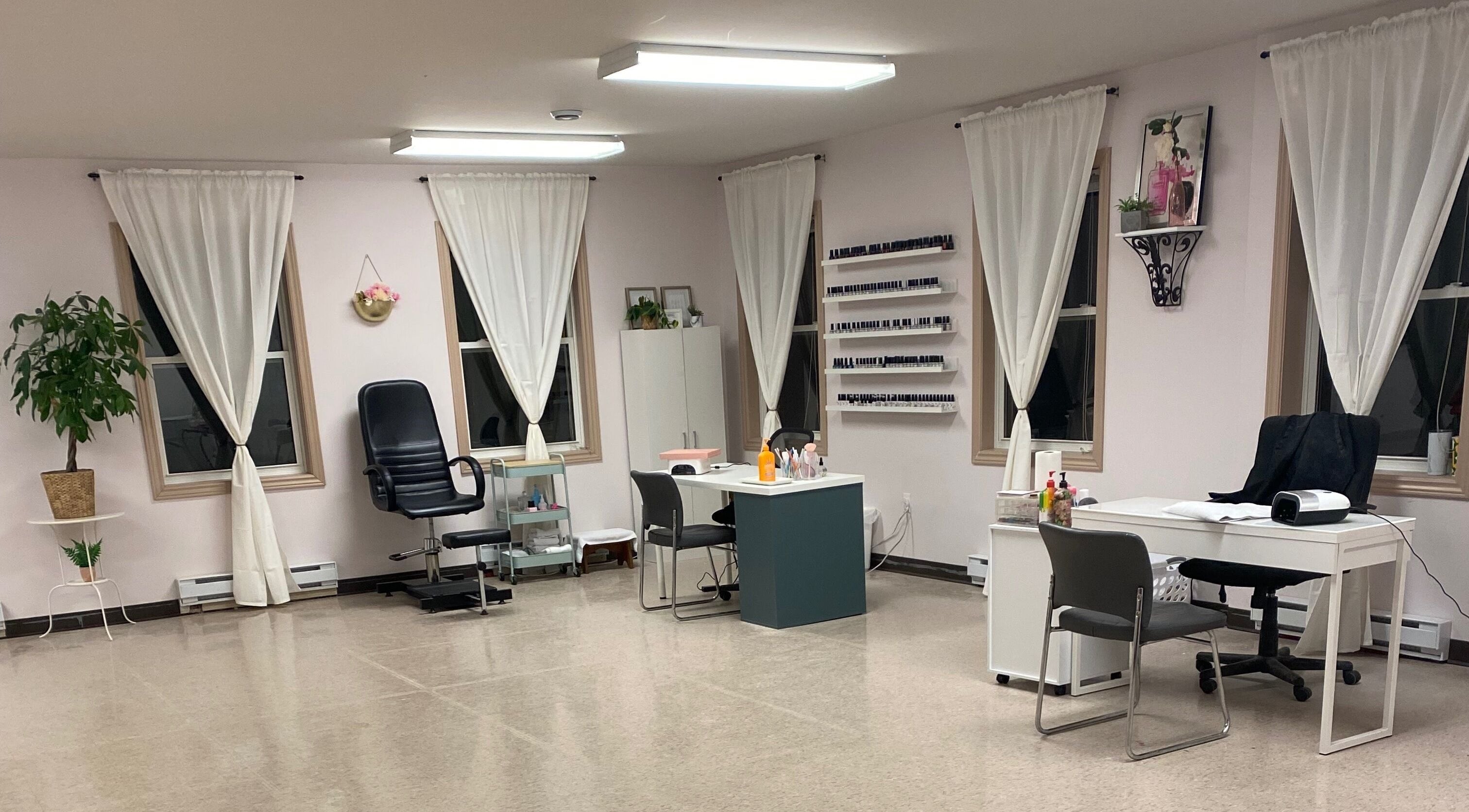 Bright, airy interior of Gel Envy - Jasmin Shears in Lower Sackville, Nova Scotia, CA with modern nail stations.