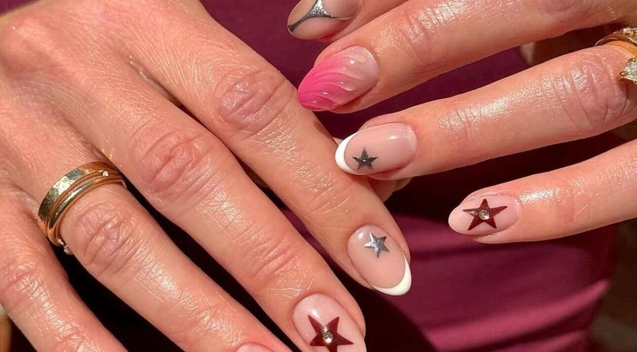 Stylish star-themed nail art at Painted by Paris, Mooloolaba, Queensland, AU offers a chic modern look.