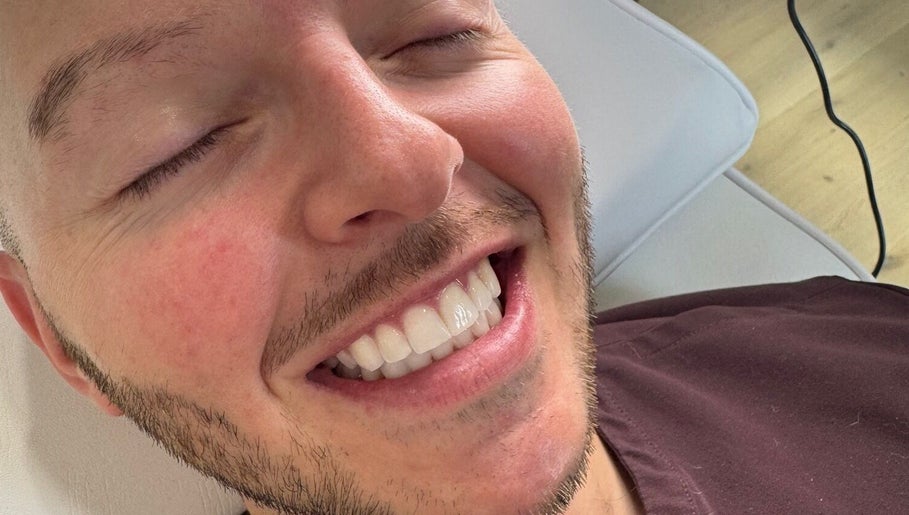 Bright smile after treatment at Blanco Cosmetic Teeth Whitening, Houston, Texas, US.