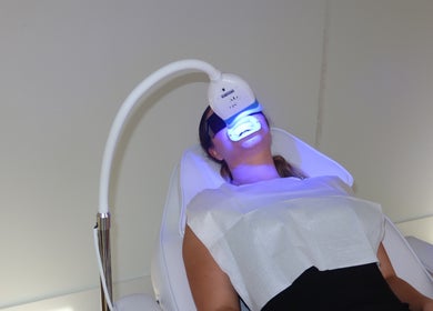 Client receiving teeth whitening at Blanco Cosmetic Teeth Whitening in Houston, Texas, US.