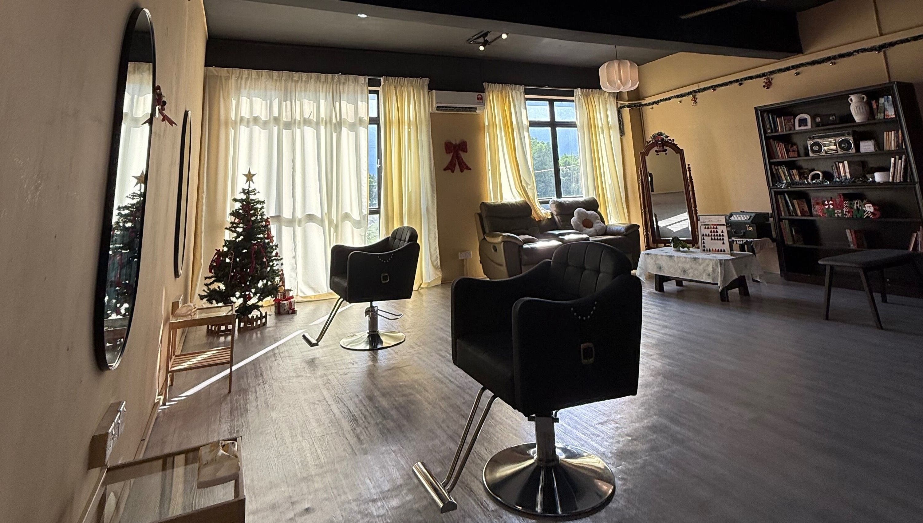 Cozy interior of The Ila’s Hair Salon in Kajang, Selangor, MY, featuring stylish chairs and Christmas decor.