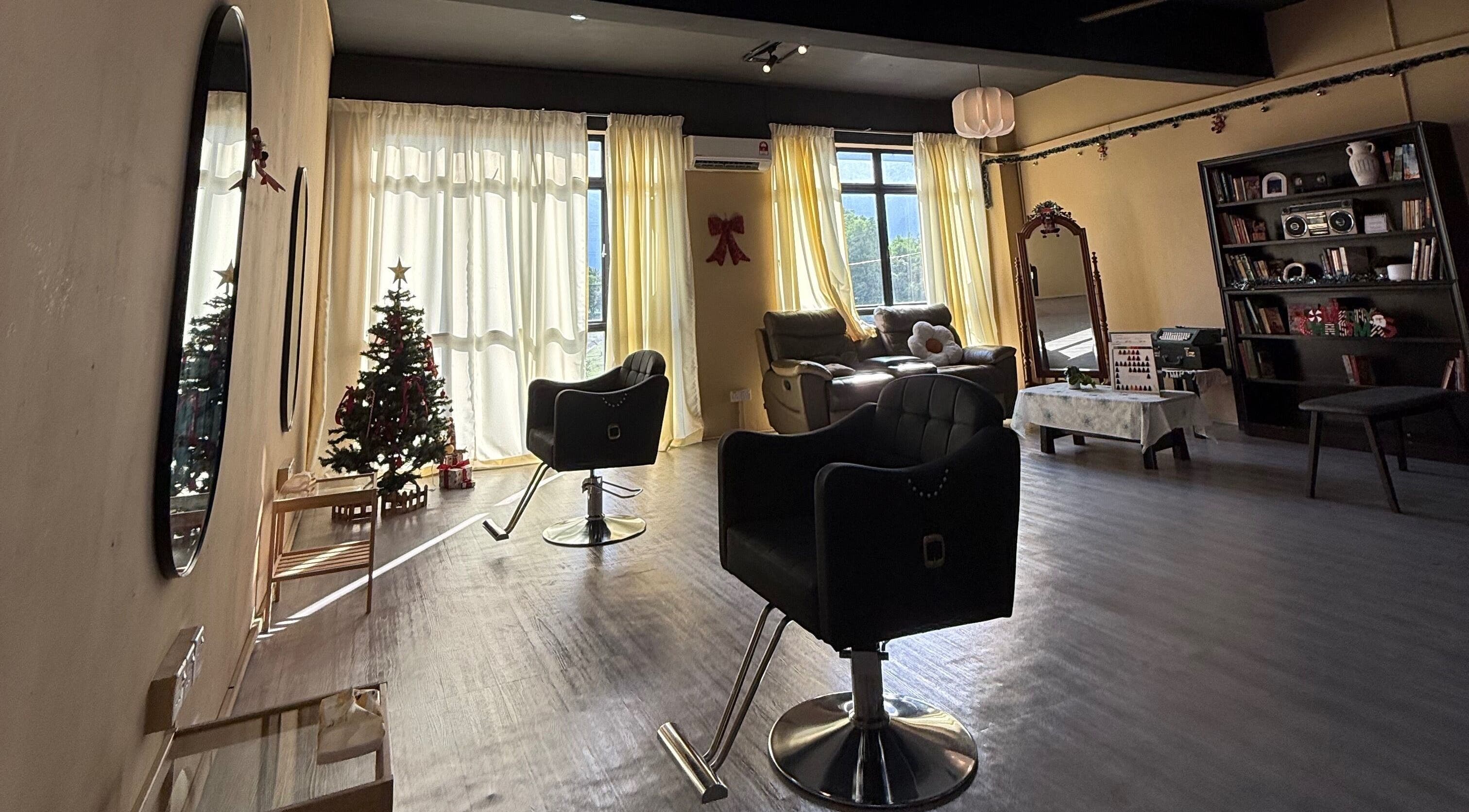 Cozy interior of The Ila’s Hair Salon in Kajang, Selangor, MY, featuring stylish chairs and Christmas decor.