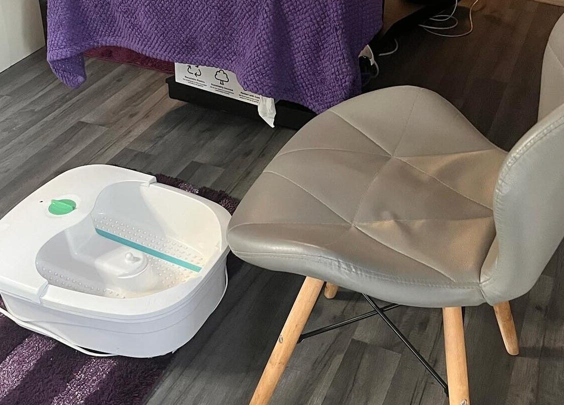 Foot spa and chair at Reflexions, Hockley, England, GB, offering a relaxing wellness environment.
