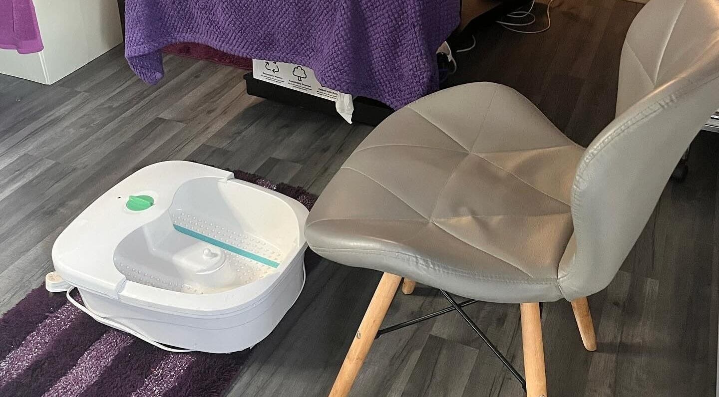 Foot spa and chair at Reflexions, Hockley, England, GB, offering a relaxing wellness environment.