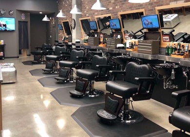 Modern barbershop interior with stylish chairs in Sumqayit, AZ, offering a luxurious grooming experience.