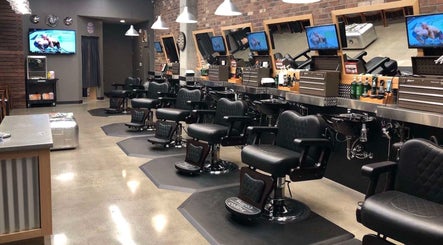 Modern barbershop interior with stylish chairs in Sumqayit, AZ, offering a luxurious grooming experience.