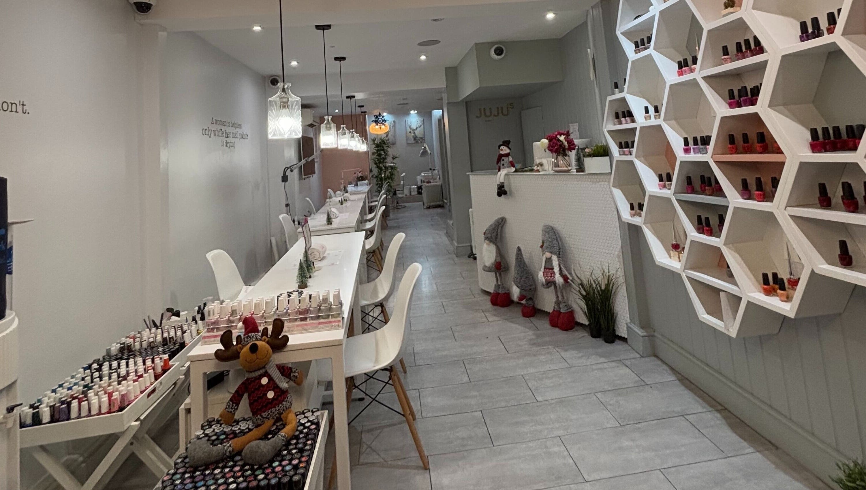 Elegant interior of Juju’s Beauty Salon in London, England, GB showcasing modern decor and cozy ambiance.