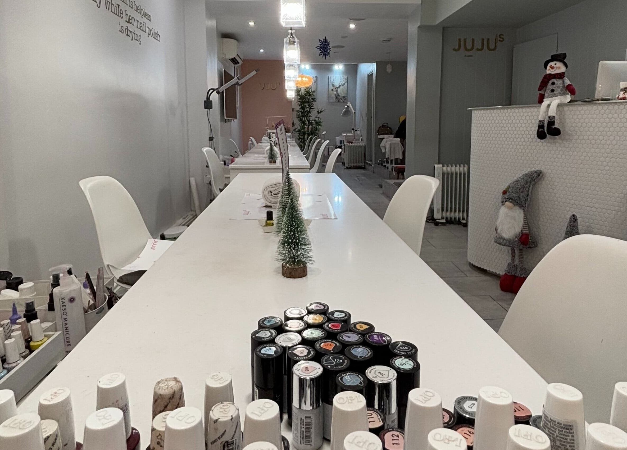 Modern interior of Juju’s Beauty Salon, London, England, GB showcasing a stylish manicure station.