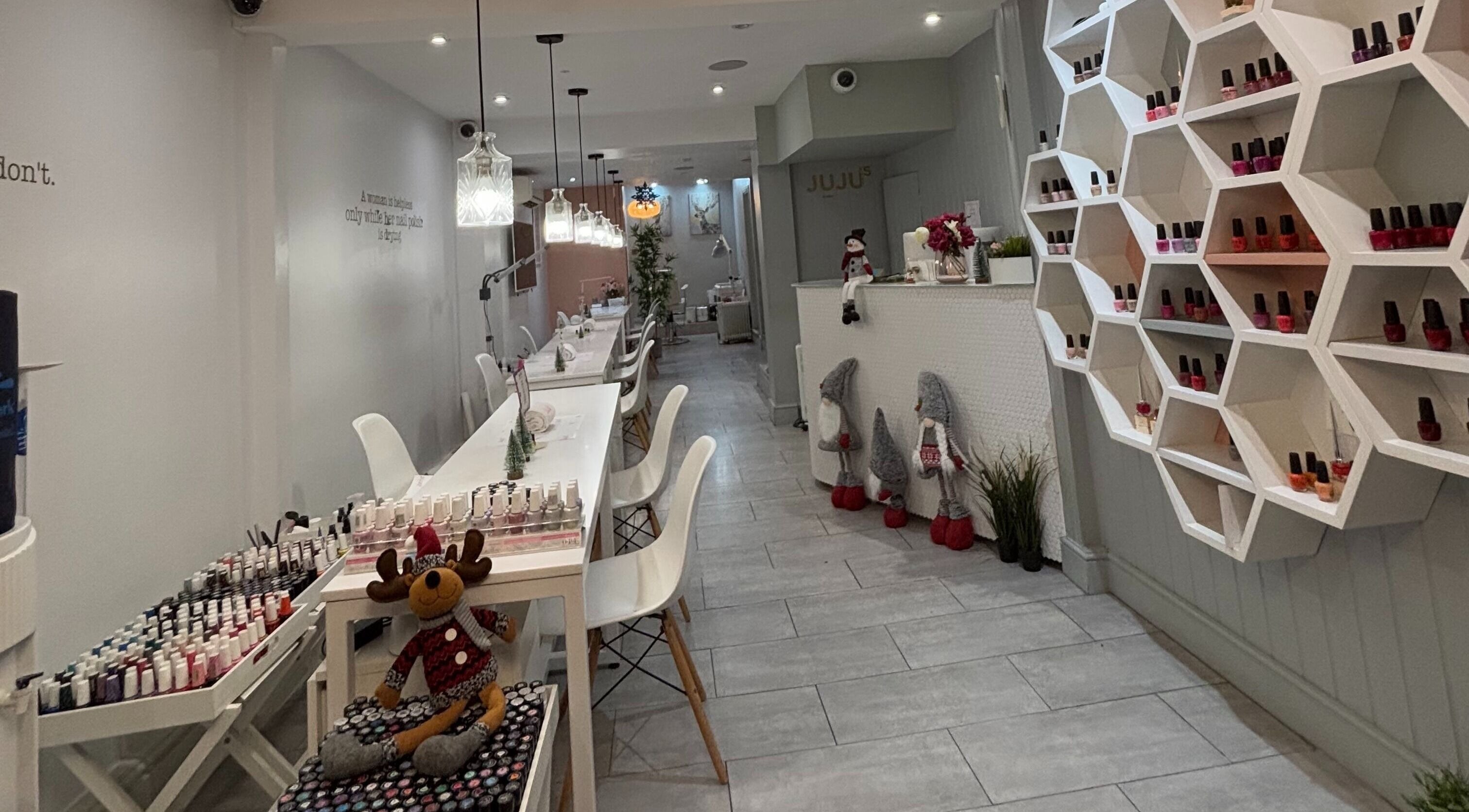 Sugilite Global nail salon interior with sleek design and polish display in London, England, GB.