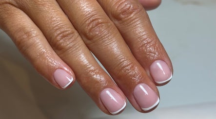 Elegant French manicure by Holly Cookson at Ramsbottom, England, GB, showcasing precise white tips.