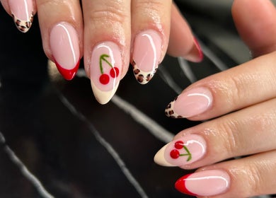 Cherry nail art on manicured nails at Heidi-Jo’s Beauty and Training, Warrington, England, GB.