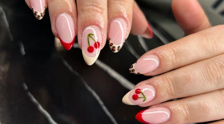Cherry nail art on manicured nails at Heidi-Jo’s Beauty and Training, Warrington, England, GB.