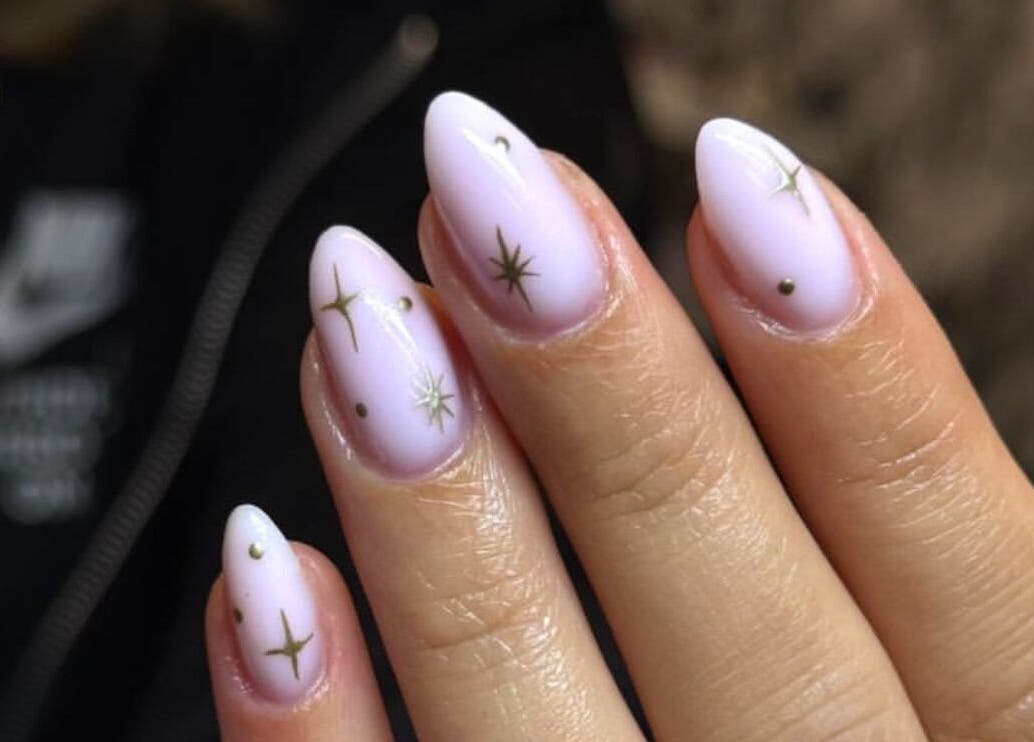 Elegant star-themed nail art by By Bethany in Newport, Wales, GB. Perfect for a chic, stylish look.