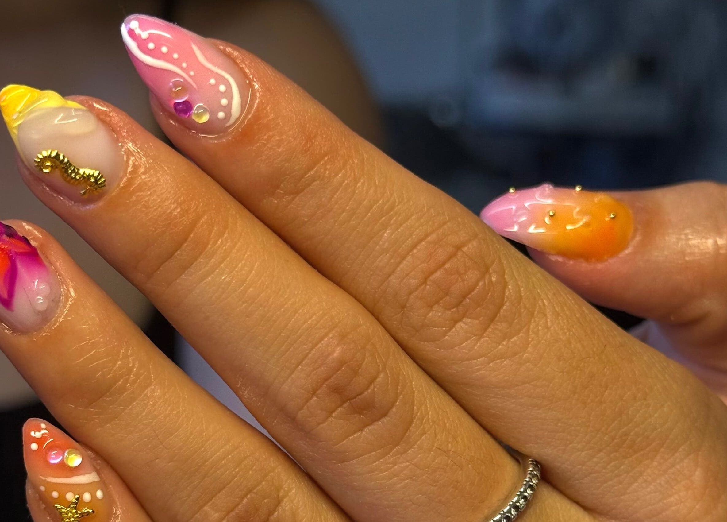 Colorful nail art showcasing intricate designs at By Bethany, Newport, Wales, GB.