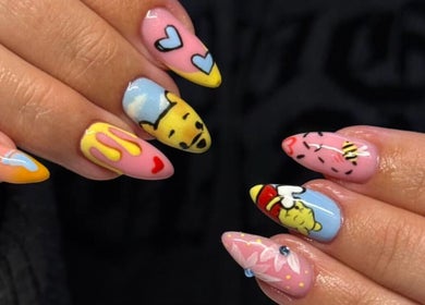 Colorful nail art designs at By Bethany, Newport, Wales, GB, featuring hearts and character figures.