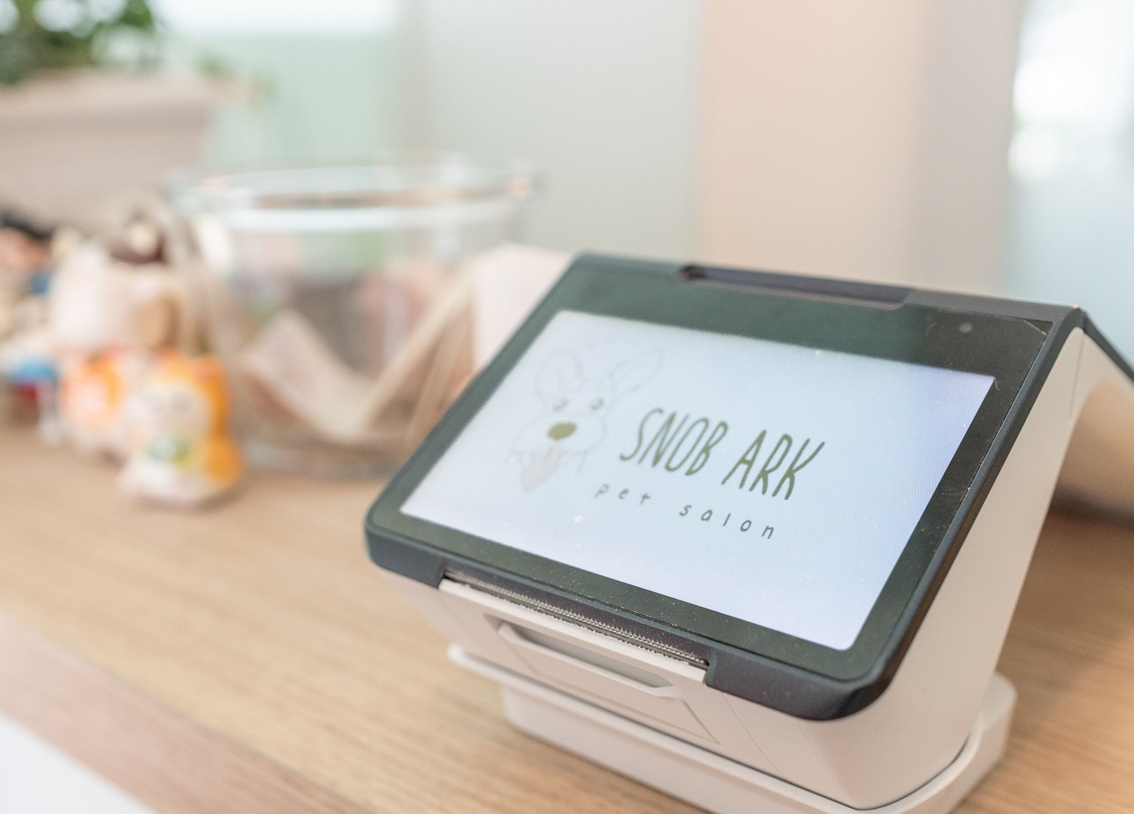 Check-in tablet at Snob Ark Pet Salon, Singapore, Singapore, SG. Cozy reception desk setup.
