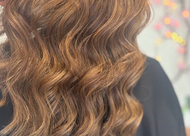 Shimmering wavy hair styled at Sharon O'Brien At Eclipse Hair and Beauty in Euxton, England, GB.