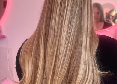 Long blonde hair styled sleekly at Hair by Susie Hancock, Ferndown, England, GB salon.